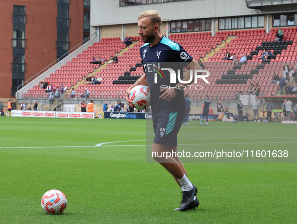 Goalkeeping Coach Daniel Matraszek participates in the pre-match warm-up during the Barclays FA Women's Super League soccer match between To...