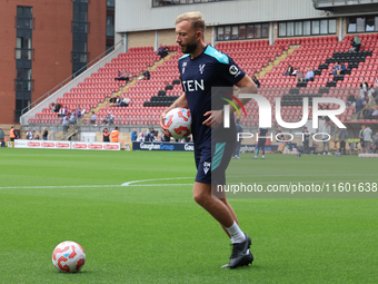 Goalkeeping Coach Daniel Matraszek participates in the pre-match warm-up during the Barclays FA Women's Super League soccer match between To...