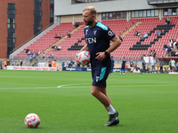 Goalkeeping Coach Daniel Matraszek participates in the pre-match warm-up during the Barclays FA Women's Super League soccer match between To...