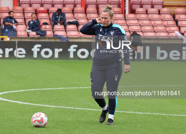 Laura Kaminski, manager of Crystal Palace Women, participates in the pre-match warm-up during the Barclays FA Women's Super League soccer ma...