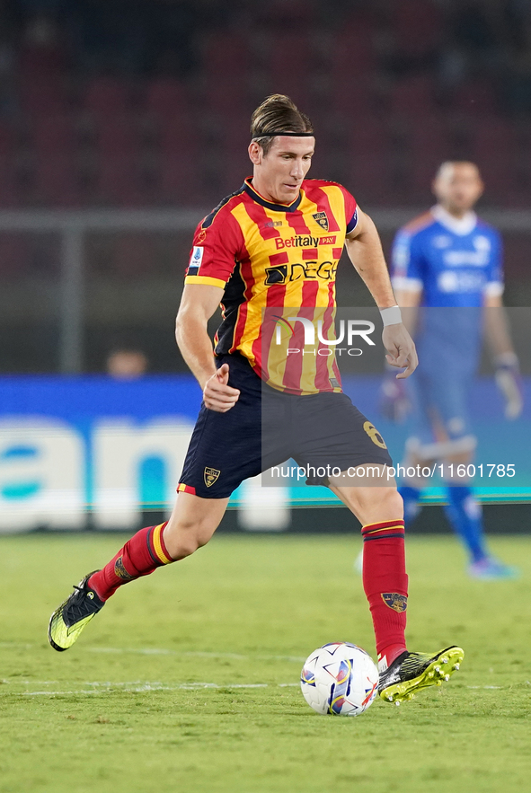 Federico Baschirotto of US Lecce is in action during the Serie A match between Lecce and Parma in Lecce, Italy, on September 21, 2024. 