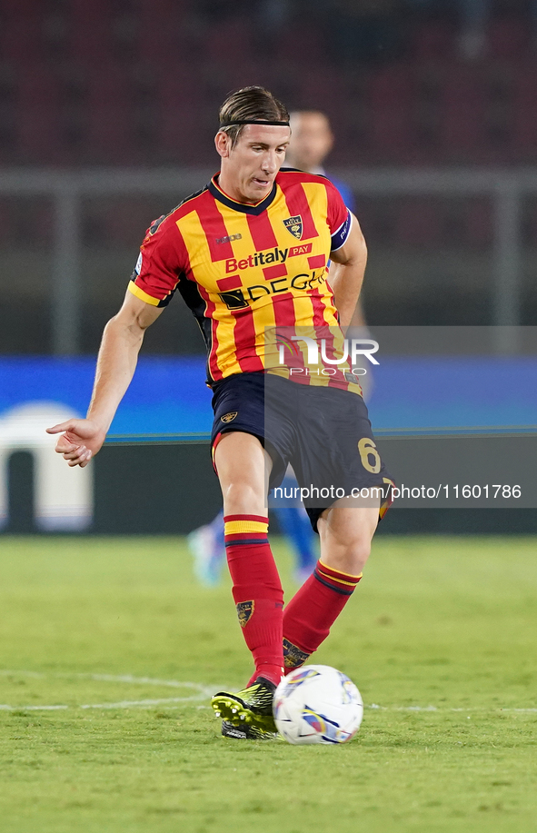 Federico Baschirotto of US Lecce is in action during the Serie A match between Lecce and Parma in Lecce, Italy, on September 21, 2024. 