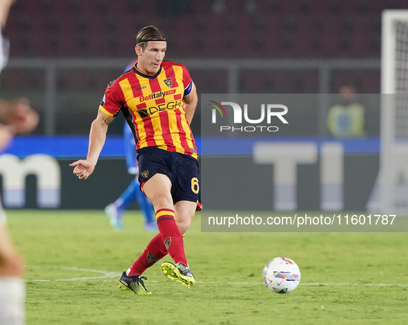 Federico Baschirotto of US Lecce is in action during the Serie A match between Lecce and Parma in Lecce, Italy, on September 21, 2024. 