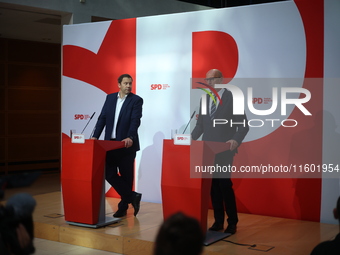 Lars Klingbeil, co-leader of the German Social Democrats, and Dietmar Woidke attend a press conference at SPD federal headquarters after the...