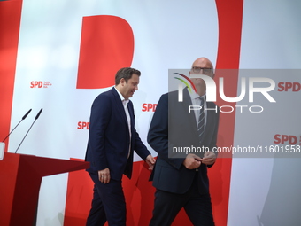 Lars Klingbeil, co-leader of the German Social Democrats, and Dietmar Woidke attend a press conference at SPD federal headquarters after the...