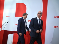 Lars Klingbeil, co-leader of the German Social Democrats, and Dietmar Woidke attend a press conference at SPD federal headquarters after the...