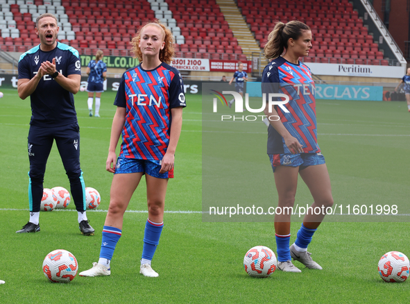 Annabel Blanchard of Crystal Palace Ladies and Katie Stengel of Crystal Palace Women participate in the pre-match warm-up during the Barclay...