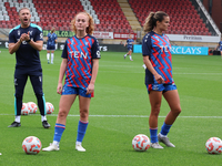 Annabel Blanchard of Crystal Palace Ladies and Katie Stengel of Crystal Palace Women participate in the pre-match warm-up during the Barclay...