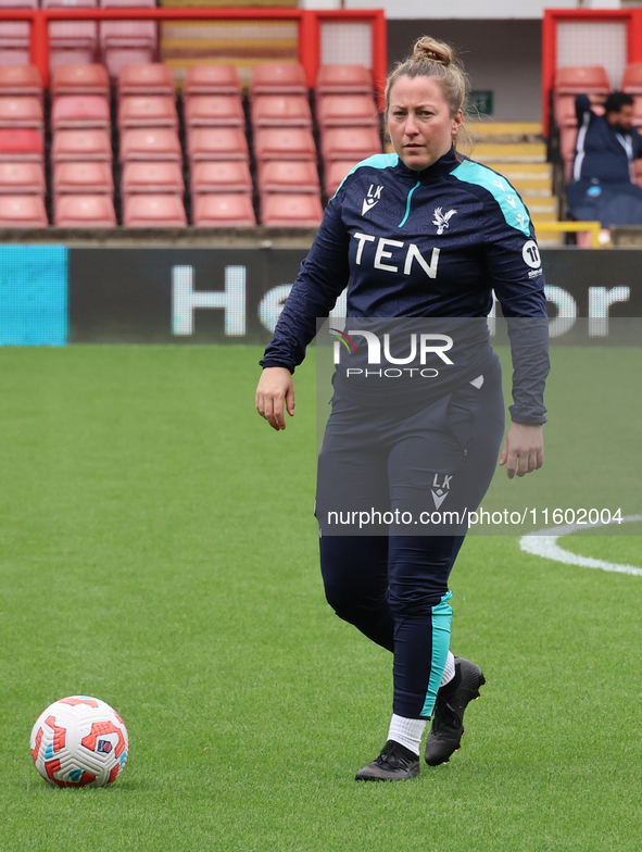 Laura Kaminski, manager of Crystal Palace Women, participates in the pre-match warm-up during the Barclays FA Women's Super League soccer ma...