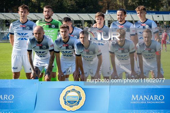 Hutnik players stand before the game between Hutnik Krakow and Resovia Rzeszow in Krakow, Poland, on September 22, 2024. Betclic 2 Liga, Pol...