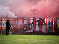 Resovia fans attend the game between Hutnik Krakow and Resovia Rzeszow in Krakow, Poland, on September 22, 2024. Team supporters burn smoke...