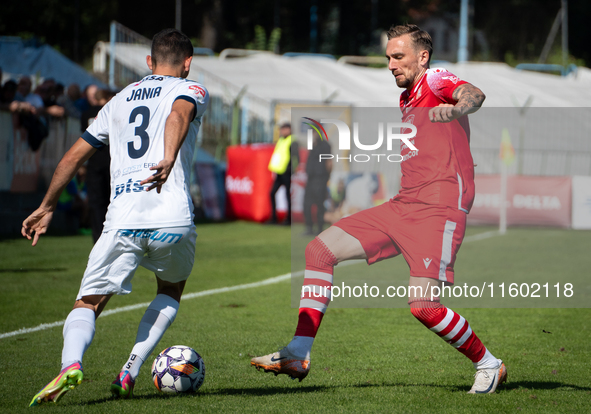 Radoslaw Adamski and Filip Jania participate in the game between Hutnik Krakow and Resovia Rzeszow in Krakow, Poland, on September 22, 2024....