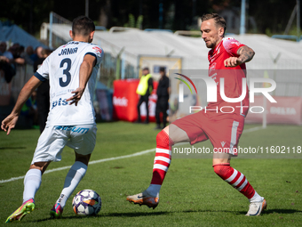 Radoslaw Adamski and Filip Jania participate in the game between Hutnik Krakow and Resovia Rzeszow in Krakow, Poland, on September 22, 2024....