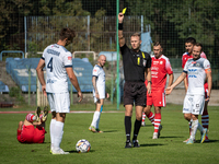 Referee Filip Kaliszewski shows a yellow card to Lukasz Kedziora during the game between Hutnik Krakow and Resovia Rzeszow in Krakow, Poland...