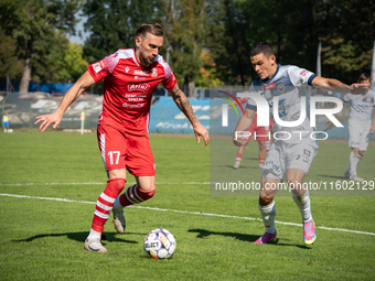 Radoslaw Adamski and Filip Jania participate in the game between Hutnik Krakow and Resovia Rzeszow in Krakow, Poland, on September 22, 2024....