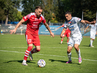 Radoslaw Adamski and Filip Jania participate in the game between Hutnik Krakow and Resovia Rzeszow in Krakow, Poland, on September 22, 2024....