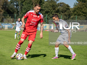 Radoslaw Adamski and Filip Jania participate in the game between Hutnik Krakow and Resovia Rzeszow in Krakow, Poland, on September 22, 2024....