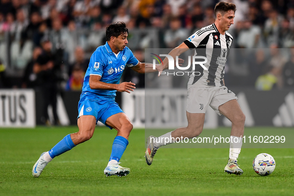 Giovanni Simeone of SSC Napoli battles for the ball with Andrea Cambiaso of Juventus during the Serie A match between Juventus and Napoli at...