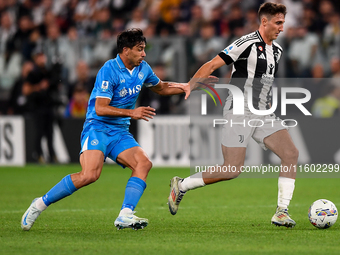 Giovanni Simeone of SSC Napoli battles for the ball with Andrea Cambiaso of Juventus during the Serie A match between Juventus and Napoli at...