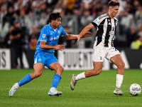 Giovanni Simeone of SSC Napoli battles for the ball with Andrea Cambiaso of Juventus during the Serie A match between Juventus and Napoli at...