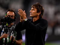 Former Juventus player and coach Antonio Conte, head coach of SSC Napoli, salutes the Juventus fans following the final whistle of the Serie...