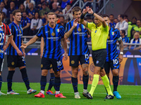 Maurizio Mariani referees during the match between FC Internazionale and AC Milan in Serie A at Giuseppe Meazza Stadium in Milan, Italy, on...