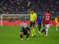 Maurizio Mariani referees during the match between FC Internazionale and AC Milan in Serie A at Giuseppe Meazza Stadium in Milan, Italy, on...