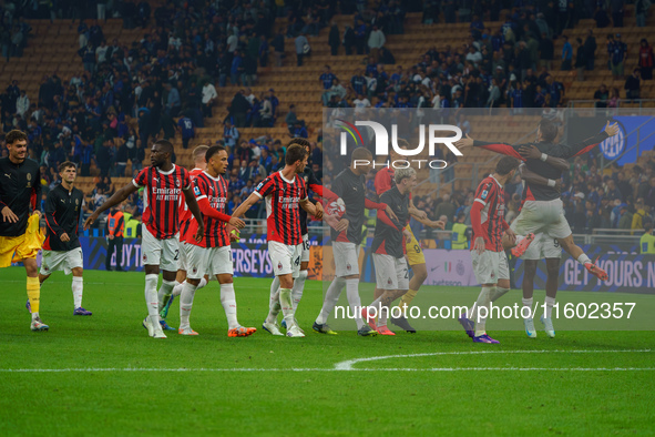 The team of AC Milan celebrates during the match between FC Internazionale and AC Milan, Serie A, at Giuseppe Meazza Stadium in Milan, Italy...