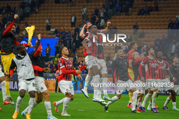 The team of AC Milan celebrates during the match between FC Internazionale and AC Milan, Serie A, at Giuseppe Meazza Stadium in Milan, Italy...