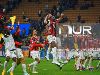 The team of AC Milan celebrates during the match between FC Internazionale and AC Milan, Serie A, at Giuseppe Meazza Stadium in Milan, Italy...