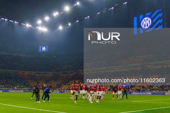 The team of AC Milan celebrates during the match between FC Internazionale and AC Milan, Serie A, at Giuseppe Meazza Stadium in Milan, Italy...