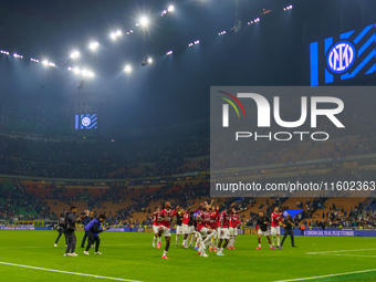 The team of AC Milan celebrates during the match between FC Internazionale and AC Milan, Serie A, at Giuseppe Meazza Stadium in Milan, Italy...