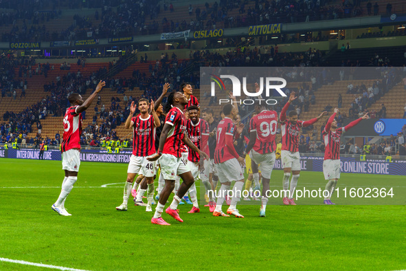 The team of AC Milan celebrates during the match between FC Internazionale and AC Milan, Serie A, at Giuseppe Meazza Stadium in Milan, Italy...