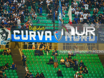 Supporters of FC Inter during the match between FC Internazionale and AC Milan in Serie A at Giuseppe Meazza Stadium in Milan, Italy, on Sep...