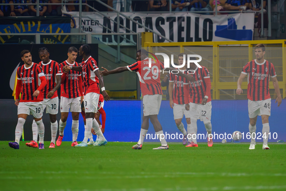 Christian Pulisic celebrates a goal during the match between FC Internazionale and AC Milan in Serie A at Giuseppe Meazza Stadium in Milan,...