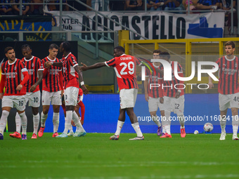 Christian Pulisic celebrates a goal during the match between FC Internazionale and AC Milan in Serie A at Giuseppe Meazza Stadium in Milan,...