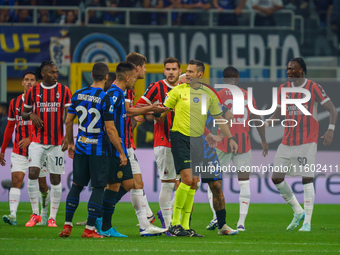 Maurizio Mariani referees during the match between FC Internazionale and AC Milan in Serie A at Giuseppe Meazza Stadium in Milan, Italy, on...