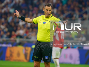 Maurizio Mariani referees during the match between FC Internazionale and AC Milan in Serie A at Giuseppe Meazza Stadium in Milan, Italy, on...