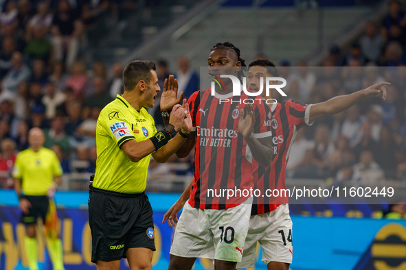 Maurizio Mariani, referee, and Rafael Leao during FC Internazionale against AC Milan, Serie A, at Giuseppe Meazza Stadium in Milan, Italy, o...