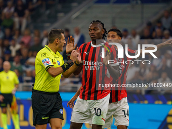 Maurizio Mariani, referee, and Rafael Leao during FC Internazionale against AC Milan, Serie A, at Giuseppe Meazza Stadium in Milan, Italy, o...