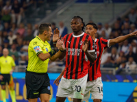 Maurizio Mariani, referee, and Rafael Leao during FC Internazionale against AC Milan, Serie A, at Giuseppe Meazza Stadium in Milan, Italy, o...