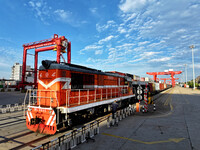 A China-Europe freight train is loaded with containers as it prepares to depart at the China-Kazakhstan (Lianyungang) Logistics Cooperation...