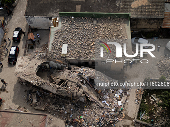 People dig through the rubble of a building that collapses in Saviano, near Naples, on Sunday morning. According to initial reconstructions,...