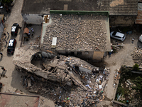 People dig through the rubble of a building that collapses in Saviano, near Naples, on Sunday morning. According to initial reconstructions,...