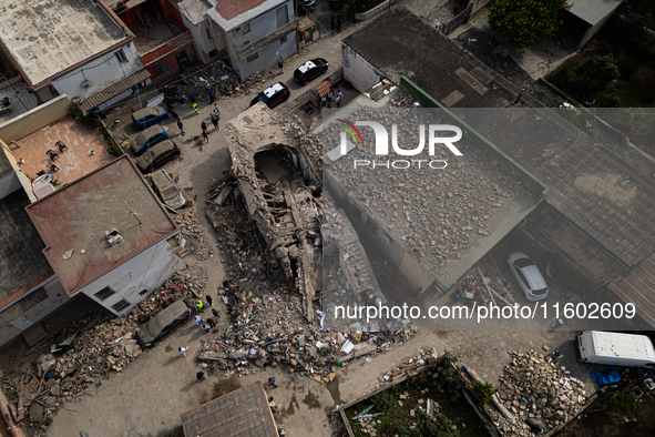 People dig through the rubble of a building that collapses in Saviano, near Naples, on Sunday morning. According to initial reconstructions,...