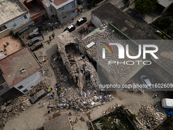 People dig through the rubble of a building that collapses in Saviano, near Naples, on Sunday morning. According to initial reconstructions,...