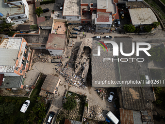 People dig through the rubble of a building that collapses in Saviano, near Naples, on Sunday morning. According to initial reconstructions,...