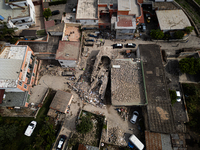 People dig through the rubble of a building that collapses in Saviano, near Naples, on Sunday morning. According to initial reconstructions,...