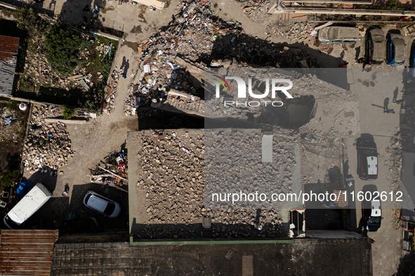 People dig through the rubble of a building that collapses in Saviano, near Naples, on Sunday morning. According to initial reconstructions,...