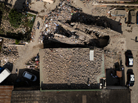 People dig through the rubble of a building that collapses in Saviano, near Naples, on Sunday morning. According to initial reconstructions,...